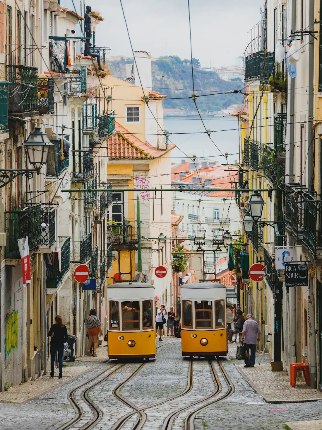 Yellow trams in a steep Lisbon street